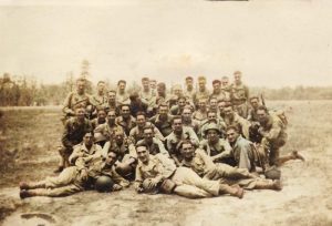 Smitty reclining in fron, on the far right, with the HQ Company/187th Regiment/11th Airborne